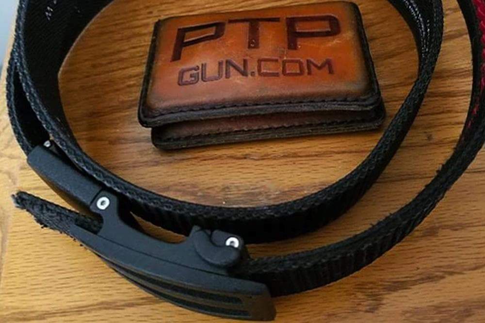 PTP  Gun.com belt buckle