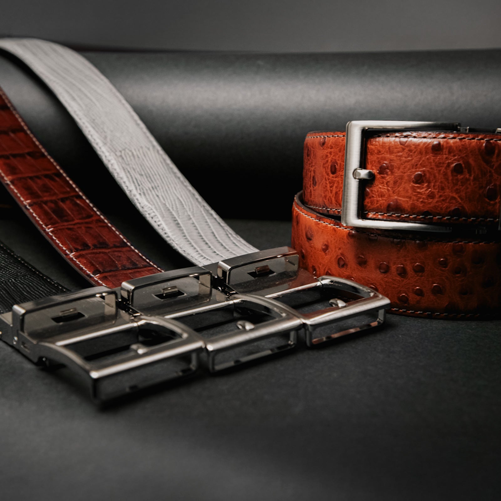 From croc and ostrich embossing to feather-light aluminum buckles, Rowland Thomas luxury belts pair timeless textures with futuristic fit.